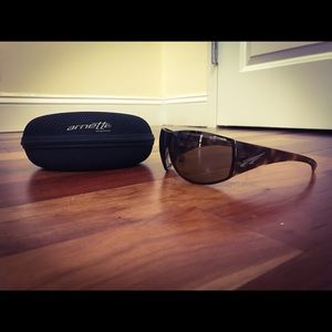 Brown sunglasses by Arnette